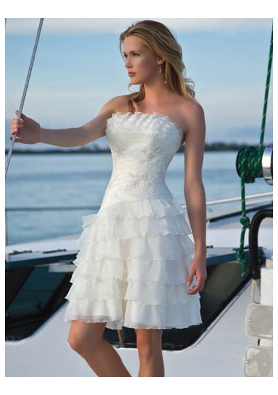 Choose a mermaid style wedding dress in white or a pale sea green