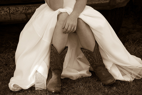 Cowboy boots on a bride says something special about the girl who chooses to