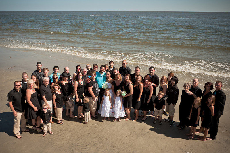  of the entire guest list dressed in their matching black wedding attire